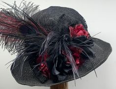 Victorian Hat Black with Plum #1114 This gorgeous Victorian style hat has a crochet Toyo hat frame with wired edge 3"-inch-wide brim. It is black with various shades of burgundy accents. There is a black lace band around the crown, black lace covering the crown, black and burgundy flowers, black lace bow, ostrich feathers and ostrich plume and peacock feather.  The brim is 3" inches and has a wire going around the edge of the brim so you can shape the brim pushing it up a bit higher on one side Gatsby Mini Hat For Kentucky Derby, Black Brimmed Mini Hats For Garden Party, Bohemian Mini Hat For Kentucky Derby Party, Bohemian Brimmed Mini Hats For Party, Adjustable Straw Bucket Hat For Party, Adjustable Straw Bucket Hat For Parties, Whimsical Black Hat With Short Brim, Black Mini Hat With Curved Brim For Garden Party, Bohemian Hats For Kentucky Derby Party