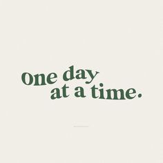 the words one day at a time written in green ink