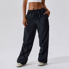 55% Nylon. 45% Polyester Soft. comfortable. skin friendly High waist designs that offer support & comfort Adjustable drawstring for a personalized fit Multiple pockets for easy storage Wide leg style gives a timeless look. while providing comfortable wear Cargo joggers for function and style in-one For: casual activities Nylon Gym Bottoms In Solid Color, Stretch Sports Pants With Drawstring, Solid Nylon Activewear With Elastic Waistband, Functional Nylon Joggers With Elastic Waistband, Sporty Bottoms With Pockets And Adjustable Waist, Athleisure Pants With Drawstring For Workout, Solid Sportswear Bottoms With Drawstring, Solid Color Sportswear Bottoms With Drawstring, Athleisure Workout Pants With Drawstring