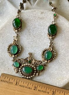 "Stunning Circa 1800s Victorian Austro Hungarian Green Chrysoprase Pearl Silver Gilt Royal Crown Antique Necklace Measures aprox 16 1/2\" Around Weighs 45.8 grams See pictures next to ruler fro scale has been tested and tests silver Although this is Hungarian pice it has a very unique Italian peruzzi feel" Heirloom Green Cabochon Jewelry, Antique Green Jeweled Necklace, Antique Green Jeweled Necklaces, Victorian Oval Green Necklace, Vintage Green Emerald Necklace For Formal Occasions, Green Victorian Necklace For Wedding, Ornate Green Oval Necklaces, Ornate Green Necklace With Intricate Design, Vintage Green Cabochon Jewelry