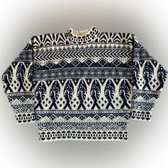 an old sweater with blue and white designs on it