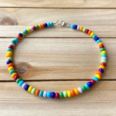 The Multicolored Anklet is a sporadic combination of every color in the rainbow. This mismatch piece can go with just about any outfit you can think of! All anklets are customizable to the size you need so please be sure to measure your ankle where you want your anklet to sit and order accordingly! This high quality beaded anklet is secured with a sterling silver lobster claw and made with glass beads that can stand the test of time, making it perfect for everyday use. Keep in mind you are looki Casual Multicolor Beaded Bracelets For Summer, Casual Multicolor Beaded Anklets, Rainbow Beaded Friendship Bracelets For Beach, Casual Rainbow Beaded Bracelets With Tiny Beads, Multicolor Tiny Beads Friendship Bracelets, Casual Rainbow Friendship Bracelets With Tiny Beads, Vibrant Colorful Beaded Bracelets For Summer, Casual Multicolor Tiny Beads Friendship Bracelets, Multicolor Summer Anklets As Gift