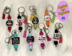 several key chains with different designs on them