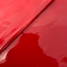 closeup of the hood of a red car