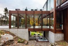 an outdoor hot tub in the middle of a building with lots of windows on it