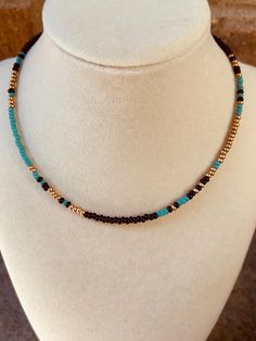 Patterned seed bead necklace with turquoise, black and gold colors. Beeded Necklace, Beaded Chocker, Blue Beaded Necklace, Crystal Lake, Gold Colors, Beaded Choker Necklace, Seed Bead Necklace, Beaded Choker, Bead Necklace