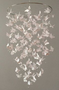 a mobile with butterflies hanging from it