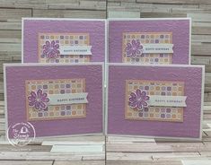 three cards with flowers on them, one is purple and the other has white dots