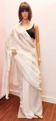 Linen sarees are always in demand.This handwoven white linen saree give you a unique style.The color is so vibrant that you are going to love it.It comes with a very narrow border,that makes it different.Linen sarees are breathable,light weight and easy to drape. Fabric: Linen by linen  Thread count:100 count Saree Color: White Occasion: Casual/Formal Saree length:5.50 mtr Blouse:80 cm Custom Stitching: Available upon request Saree Embroidery: Available upon request Blouse Stitching: Available u White Cotton Silk Pre-draped Saree For Wedding, White Handloom Pre-draped Saree, White Cotton Silk Pre-draped Saree With Cutdana, White Slub Silk Pre-draped Saree, White Cotton Silk Pre-draped Saree, Elegant White Slub Silk Saree, White Slub Silk Pre-draped Saree With Cutdana, White Slub Silk Pre-draped Saree For Wedding, White Slub Silk Saree With Dupatta