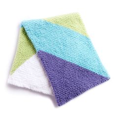 two towels folded on top of each other with different colors and patterns in the middle