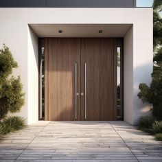 an entrance to a modern home with wooden doors