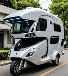 an electric motor home is parked on the street