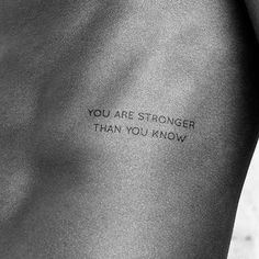 the back of a person's stomach with an inscription on it that says, you are