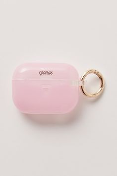 a pink case with a gold ring on it