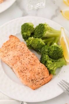 salmon and broccoli on a white plate with the words air fryer salmon