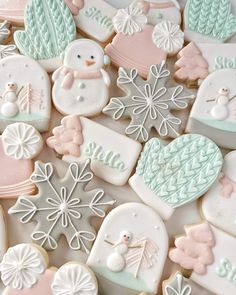 decorated cookies with frosting and icing on top of each other, including snowmen