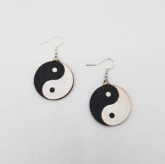 "Yin Yang earrings, painted wood earrings, Black and White earrings, gift idea, stocking stuffer, Sterling Silver Hooks Hand painted Earth engraved wooden earrings Light weight earrings perfect for every day wear 1.25\" x 1.25\" circlular shaped earring Made from 1/8\" thick wood Eco-friendly packaging Ships in 1-2 days, expected delivery within a week" Symbolic Black Earrings For Gift, Hand Painted Black Earrings For Gift, Painted Earth, Black And White Earrings, Unisex Earrings, Wooden Earrings, Earrings Black, White Earrings, Wood Earrings