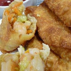 some fried food on a plate with dipping sauce