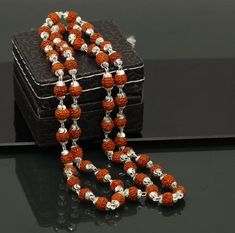 Sterling silver solid handmade natural rudraksh beads chain necklace .54+1 bead or rudraksh is use in this necklace, it use as japp mala, we pray to god 108 time for any wish.so this is half japp mala 26 inches long necklace. unisex jewelry form rajashthan india. Rudraksha is belong to god shiva. Metal-Sterling silverBrand-traditional-jewellery.Length-26 inchesWidth-6.5 mm approx.Weight-17.00 grams.Type- beaded necklace.Stone- Natural Rudrakshamakes excellent gifting and collectible pieces Silver Mala With Round Beads For Meditation, Silver Mala With 108 Beads As Gift, Spiritual Silver Beads Mala Gift, Spiritual Silver Mala With 8mm Beads, Silver Spiritual Mala For Puja, Silver Mala With Round Beads For Gift, Silver Mala With 108 Beads For Meditation, Silver Mala For Festivals, Silver Mala For Festival Gifts