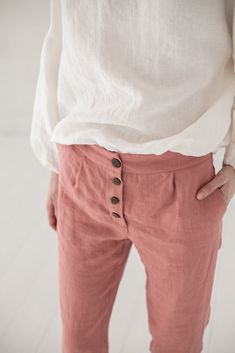 "DETAILS * Tapered high waist pants * With two side pockets and natural coconut buttons at the front * Classic shape pants for women * Made from soft washed medium weight (185 gsm) 100 % European linen fabric * Height of the model is 177 cm (5' 8\") and she is wearing pants in size XS and living coral color * The length of the outer seam of the linen pants is +/- 94 cm (37\"), the length of the inner seam is +/- 74 cm (29.1\") * Please choose another color and size on the right * Product number: High Waist Linen Bottoms With Buttons, Straight Leg Bottoms With Buttoned Pockets For Summer, Summer Straight Leg Bottoms With Buttoned Pockets, Summer Straight Pants With Button Closure, Relaxed Fit Tapered Pants With Buttons, High Waist Linen Bottoms With Button Closure, Summer Straight Pants With Button Cuffs, High Waist Bottoms With Buttoned Pockets, Linen Workwear Pants With Buttons