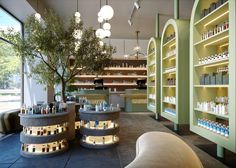 the inside of a store with shelves filled with bottles