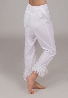 All cotton pantaloons are long and trimmed in three rows of flounced lace, finished with a satin ribbon. Elastic waist for comfort. Machine or hand wash on gentle cycle in cold water; Tumble dry on low setting or hang to dry. Proudly made in the US by Recollections. Please choose white, ivory, or black trim when ordering. Fitted Cotton Bloomers With Ruffles, Elegant Cotton Bottoms With Ruffles, Fitted Ruffled Bottoms For Daywear, Fitted Cotton Bottoms With Lace Trim, Daywear Cotton Bloomers With Ruffles, Fitted Ruffle Bottoms For Daywear, Cotton Bloomers With Ruffles For Daywear, Cotton Ruffle Long Pants, Daywear Stretch Bottoms With Ruffles