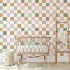 a baby's crib in front of a checkered wallpapered background