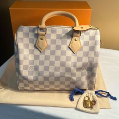 Like New Condition Exterior Shows Creases From Being Folded In Box Interior Clean Damier Azur Coated Canvas Made In France Light Patina On Leather Comes With Lock/Key, Box, And Dust Bag **Discounted Style*** **No Longer Available On Lv** Lv Speedy 25 Bandouliere, Damier Azur Speedy, Louis Vuitton Speedy 35, Louis Vuitton Speedy 25, Louis Vuitton Speedy 25 Damier Ebene, Speedy 25, Interior Clean, Key Box, Louis Vuitton Speedy