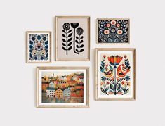 four framed pictures hanging on the wall with flowers and houses in them, each one has an individual's own artwork