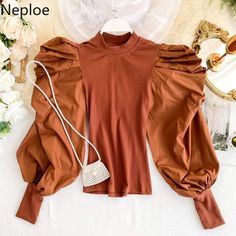 This ststement sleeve blouse is everything and more ! Great stretch .. can fit a S/M Top Earrings, Knitted Blouse, Vintage Autumn, Power Puff, Puff Sleeve Blouse, Puff Sleeve Top, Puff Sleeve, Rain Jacket, Sleeve Blouse