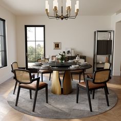 a dining room table with chairs around it and a chandelier hanging from the ceiling