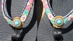 Bring on the Bling! Jazz up any warm weather outfit with a little jewelry for your feet.  You're sure to stand out in these one-of-a-kind sandals.  These hand beaded flip flops were made using purchased FloJo Flip Flops which are a quality brand with good support.  The beaded embellishment is stitched onto the strap between the soft cloth and vinyl layer so that there is nothing to irritate the foot.  Stitching was completed with Fire Line 6 lb and is reinforced to insure the beads stay secure. Adjustable Beaded Flip Flops For Vacation, Handmade Casual Flip Flops For Festivals, Bohemian Beaded Flip Flops For The Beach, Handmade Summer Flip Flops For Festivals, Bohemian Beaded Beach Flip Flops, Beaded Multicolor Flip Flops For Festivals, Multicolor Beaded Flip Flops For Festival, Festival Beaded Multicolor Flip Flops, Festival Multicolor Beaded Flip Flops