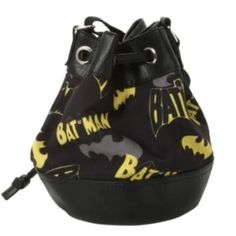 a black and yellow bag with batman logos on it