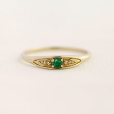 May birth ring This ring will be a very meaningful piece for those born in May. May's birthstone and birth flower are emerald and lily of the valley. Vivid green emerald and delicately carved lily of the valley will shine and bloom forever. This dainty and slim signet ring is comfortable to wear all the time. This piece will be perfect gift for both to others and yourself.   * Detail * Material : 14K solid gold, 18K solid gold, 925 sterling silver Color : Yellow gold, White gold or Rose gold(925 Birth Ring, Flat Rings, Spirit Fingers, Emerald Forest, Instead Of Flowers, Born In May, Forever Rings, Ring Birthstone, Ring Emerald