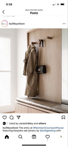 a coat rack with two coats hanging on it