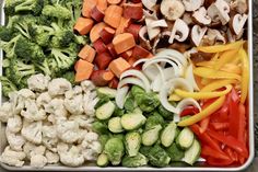 a tray filled with different types of veggies next to mushrooms and broccoli