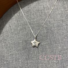 This simple and delicate smiley star pendant necklace is made of 925 silver With a delicate chain Showing a gentle and lovely design style The star-shaped pendant is engraved with a smiling expression Adds a unique flavor to the whole necklace This necklace is perfect for daily wear Whether layered or worn alone This necklace is perfect for everyday wear. Whether it's a gift for yourself or a friend This necklace conveys beauty and happiness The star symbolizes dreams and hope. Bringing you more positive energy Hope you like it. Fashion Jewelry Editorial, Smiley Necklace, Gifts For Friends Christmas, Friends Christmas Gifts, Smiling Expression, Silver Star Necklace, Silver Charm Necklace, Star Necklace Silver, Cute Star