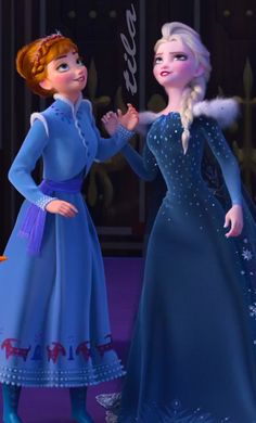 two frozen princesses standing next to each other