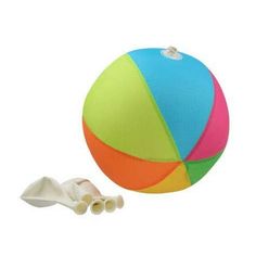 an image of a beach ball and shells