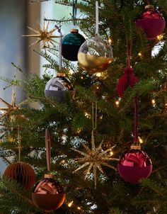 a christmas tree with ornaments hanging from it