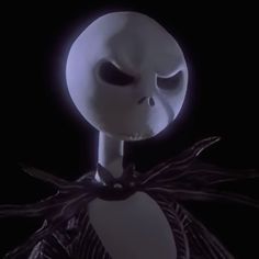 an animated skeleton wearing a white mask and black ribbon around its neck, standing in front of a dark background