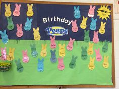 a bulletin board decorated with peeps easter bunnies