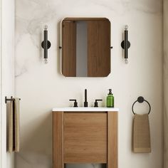 a bathroom with a sink, mirror and towel rack