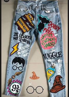 a pair of jeans with harry potter stickers on them