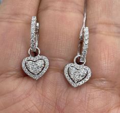 Beautiful heart shape dangle diamond earrings. You can wear the small hoops on its own also by removing the diamond heart dangle. Which is nice if you want to be super simple sometimes. The diamonds are all white and very sparkling. Good quality diamonds. The dangle is very pretty, not too long just below the lobe. Excellent craftsmanship on these earrings. Nice and secure clasp. Measures about 24 x 10.2mm. Wholesale price, Don't pay retail! Genuine natural round brilliant cut diamonds total wei Diamond Heart Earrings, Diamond Heart Shaped Earrings For Gift, Diamond Cut Heart Earrings For Gift, Heart-shaped Diamond Earrings For Weddings, Formal Heart-shaped Diamond Earrings, Heart-shaped Diamond Earrings For Gift, Heart Diamond Earrings, Morganite Engagement Ring Halo, Gold Heart Earring