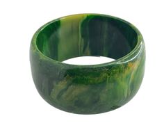 Vintage Bakelite Bangle. Chunky 1.5 Inch Thick. Dark Green Swirled with Yellow. Circa 1940s. Tested, Guaranteed. 55 Grams Tested, Guaranteed Bakelite. No chips, no crazing, no cracks. Please see photos for closeups and details. SIZE: Standard 2.5" opening, as all vintage bakelite bangles have. About 1.5 inches wide. Wall thickness is about 1/4", and it is domed (rounded). CONDITION: Very nice vintage condition, with expected surface wear. COLOR:  It is dark.  As you know, catalin (aka bakelite) material develops a patina over the decades, and the original colors become darker and muted.   The blues are harder to find because they sometimes lurk under what appears to be black or sometimes dark green. The color of this particular bangle would have originally been green with hints of inky blu Bakelite Bangles, Vintage Bakelite, Swirl Pattern, Dark Green, Swirl, Bangle Bracelets, Patina, Bangles, Chips