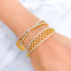 This exquisite set of 18k gold bangles, with a total weight of 32.4 grams, features a timeless tapered design adorned with dazzling diamonds. The yellow gold finish enhances their luxurious appeal, making them perfect for any special occasion. Each bangle is set with a total diamond weight of 6.51 carats, featuring F-G color and VS quality diamonds in round brilliant cut shapes. With a bangle size of 2.6 and an opening diameter of 2.35 inches, these pieces offer both elegance and comfort. Ideal Wedding Bangle In Yellow Gold With Brilliant Cut, Elegant Gold Bangle With Brilliant Cut, Luxury Cubic Zirconia Bangle With Elegant Design, Wedding Brilliant Cut Yellow Gold Bangle, Wedding Yellow Gold Bangle With Brilliant Cut, Gold Bangle With Pave Setting As Gift, Elegant Gold Bangle With Single Cut Diamonds, Gold Bracelets With Pave Setting For Wedding, Formal Gold Bangle With Single Cut Diamonds