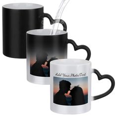 two black and white coffee mugs with an image of a kissing couple