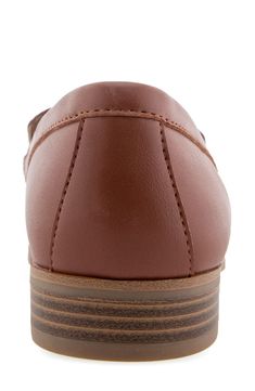 An almond toe adds modern polish to a classic loafer-inspired flat with an embossed vamp and a shock-absorbing sole. Synthetic upper, lining and sole Imported Brown Synthetic Loafers With Textured Sole, Classic Brown Synthetic Loafers, Brown Synthetic Plain Toe Loafers, Brown Loafers With Cushioned Footbed For Office, Synthetic Closed Toe Loafers With Stitched Sole, Brown Cushioned Loafers For Office, Classic Synthetic Moccasins With Round Toe, Brown Synthetic Slip-on Loafers, Brown Loafers With Rubber Sole, Medium Width