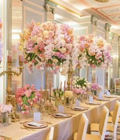 a table set with flowers and candles for a formal dinner or wedding reception at the hotel